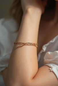 Delicate chain wrist tattoo for women resembling bracelet jewelry — fine-line minimalist design symbolizing connection and unity.
