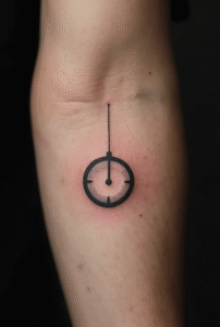 “Minimal fuel gauge tattoo on a man’s inner forearm, detailed with fine-line markers representing energy and balance.”